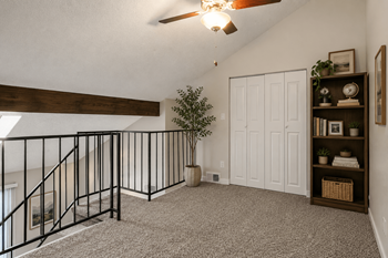 Loft with carpet at hilltop view apartments